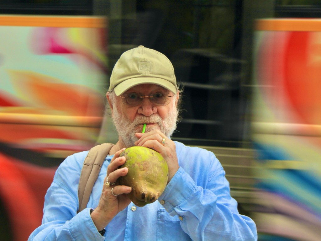 John David drinking from a fresh coconut in India